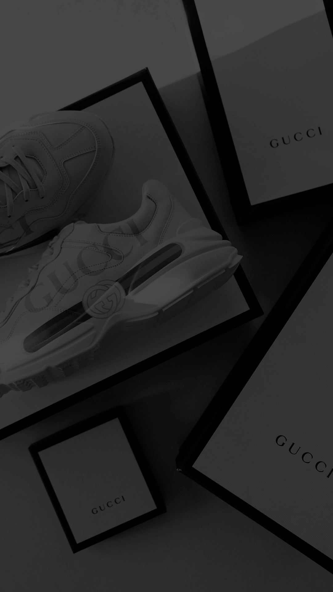Shop Gucci CTA -
Cropped shot of Gucci shoes in a collage around multiple boxes of Gucci