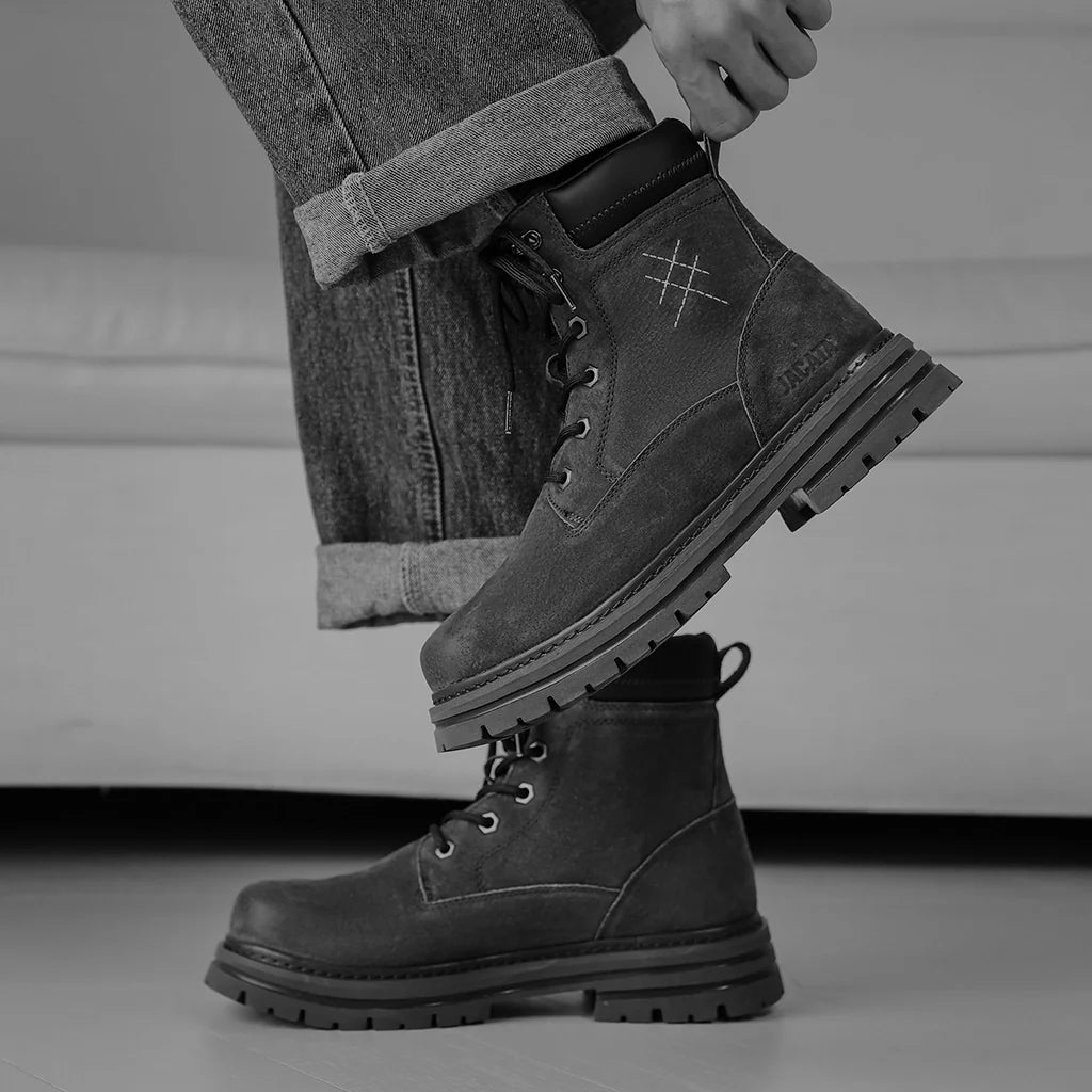 Close up of man wearing rugged lace up designer boots from the EDRM Men’s Boots collection, showcasing premium designer clothes and luxury streetwear UK footwear essentials