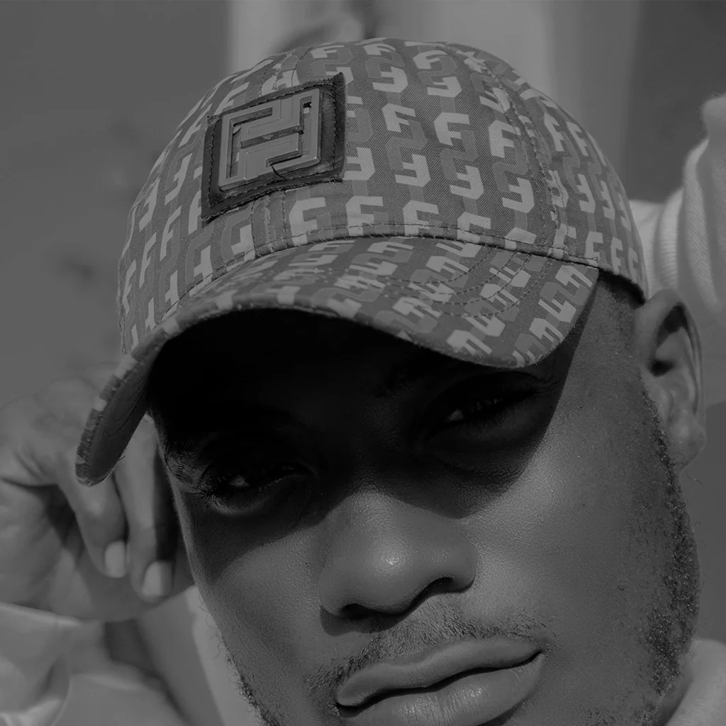 Man wearing Fendi logo cap from the EDRM Men’s Hats and Caps collection, showcasing designer clothing UK style and luxury streetwear UK trends from top UK streetwear brands